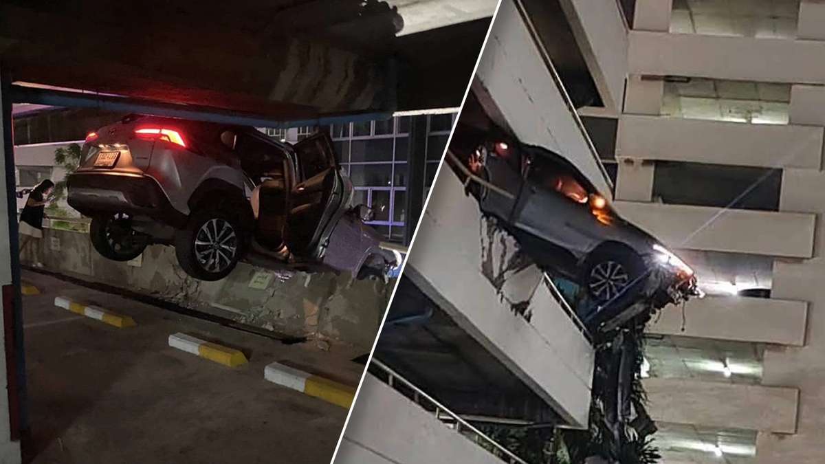 SUV hängt nach Crash aus Parkhaus