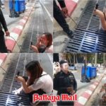 Pattaya-Polizisten fischen verlorene Kopfhörer aus dem Abfluss Pattaya-Polizisten fischen verlorene Kopfhörer aus dem Abfluss
