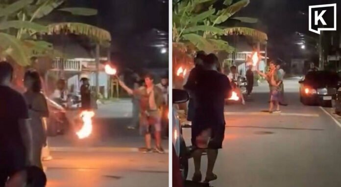 Ausländer behindern Verkehr mit Feuershow